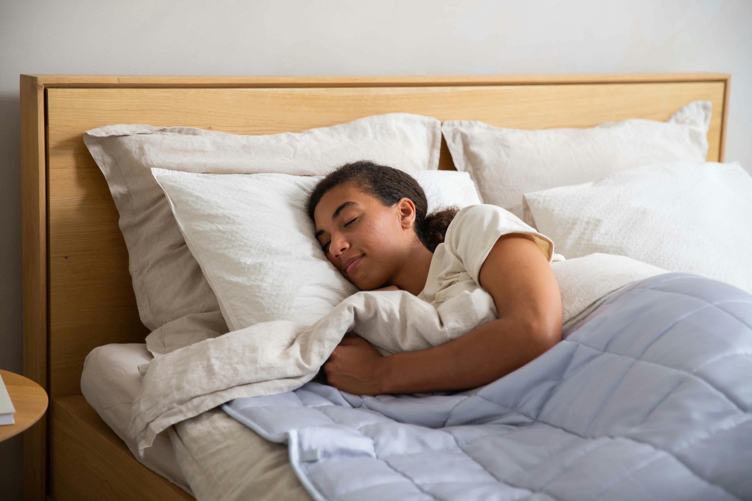 woman sleeping soundly in her bedroom